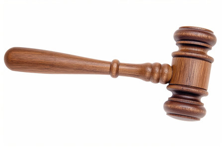 A wooden judges gavel on a white background symbolizing law, justice, and authorityの素材
