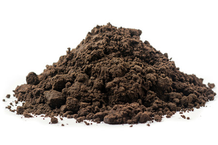 A heap of rich, dark fertile soil isolated on a white background representing agriculture, gardening, and environmental conceptsの素材