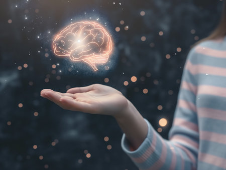 A person holds out their hand with a glowing brain hologram floating above it, symbolizing creativity, intelligence, and innovation against a dark, starry backgroundの素材