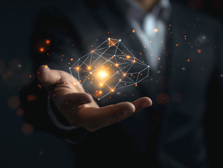 A businessman in a suit holds a glowing geometric shape, symbolizing innovation and technology.の素材