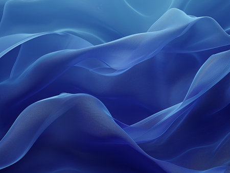 Flowing blue fabric waves create a serene and ethereal abstract background, evoking calm and tranquility.の素材
