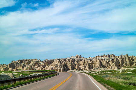 A long way down the road of Badlands National Park, South Dakotaの写真素材