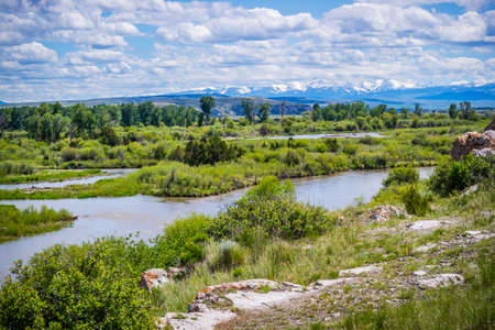 A large refreshing flow of water with a peaceful view of the pond in the preserve parkの写真素材