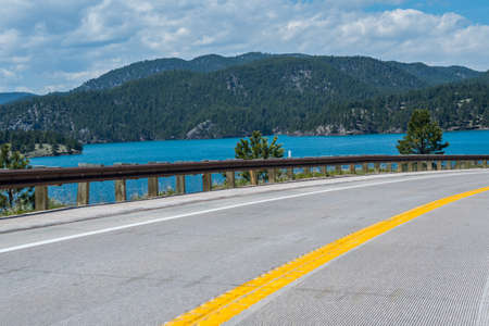 Road trip and traversing along the beautiful forest of the placeの写真素材