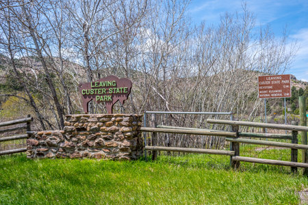 Custer SP, SD, USA - May 24, 2019: A leaving signboard at the exit point of national parkのeditorial素材