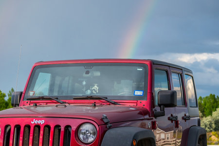 Three Forks, MT, USA - June 29, 2019: A Jeep Wrangler Unlimited Sports parked along the preserve parkのeditorial素材