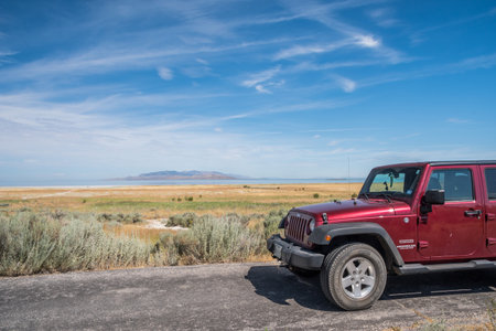 Antelope Island SP, UT, USA - August 4, 2019: A Jeep Wrangler Unlimited Sports parked along the preserve parkのeditorial素材