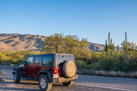 Saguaro NP, AZ, USA - November 16, 2019: A Jeep Wrangler Unlimited Sports parked along the preserve parkのeditorial素材