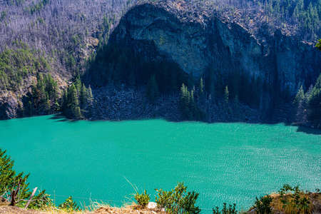 A large refreshing flow of water with a peaceful view of the lake