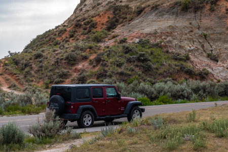 Theodore Roosevelt NP, ND, USA - July 6, 2021: A Jeep Wrangler Unlimited Sports parked along the preserve parkのeditorial素材
