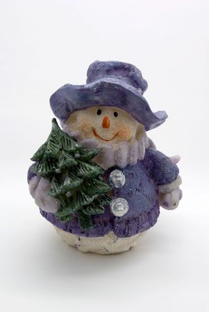 Toy a snowman with a fir tree on a white backgroundの写真素材