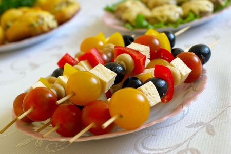 shashlik from olives, tomato, cheese and saladの写真素材