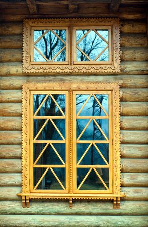 wooden window on the log wall の写真素材