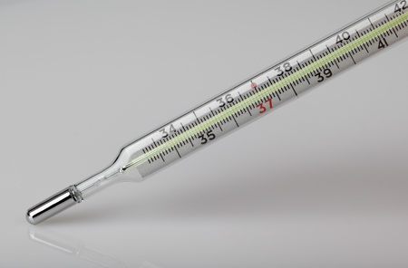 Thermometer on the grey background の写真素材