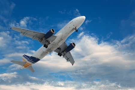 Big airliner in blue sky with clouds. の写真素材