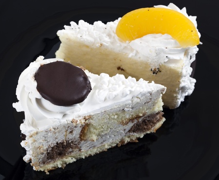 Sweet piece of cake on black plate.の写真素材