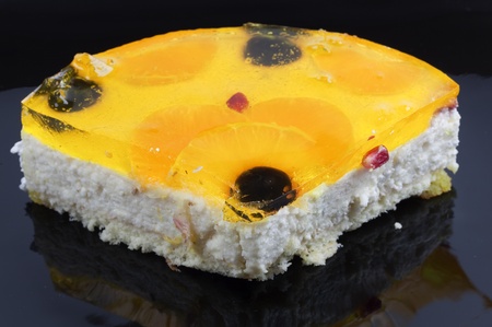 Sweet piece of cake on black plate の写真素材