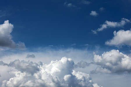 Image of a blue sky with white clouds.