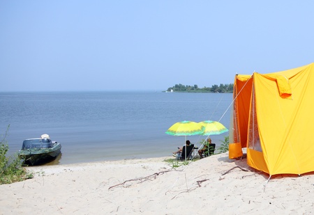 Rest near the river Dnepr with tents and boatの写真素材