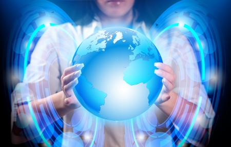 Abstract, blue planet earth in hands of girl.の写真素材