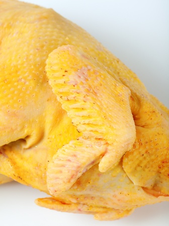 raw chicken carcass on a white backgroundの写真素材