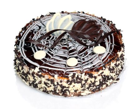 Delicious cake with chocolate and nuts, garnished with cream.の写真素材