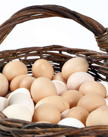 Chicken eggs in a wicker basketの写真素材