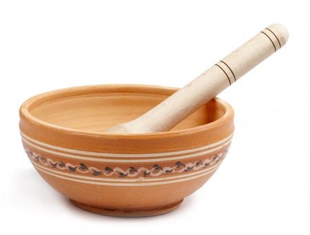 empty clay bowl with a wooden spoon isolated on white backgroundの写真素材