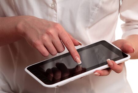 Woman using digital tablet computer isolated on white backgroundの写真素材