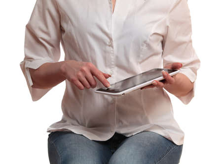 Woman using digital tablet computer isolated on white backgroundの写真素材