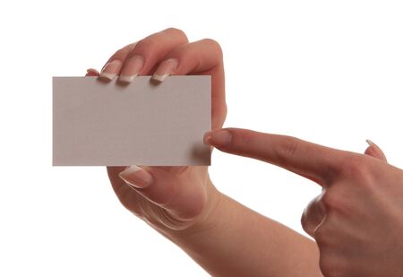 hand of a girl with a business card isolated on white backgroundの写真素材