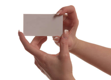 hand of a girl with a business card isolated on white backgroundの写真素材