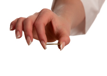 Hand with a coin isolated on white backgroundの写真素材