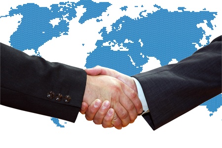 Handshake of business partners, over a map of the Earth.の写真素材