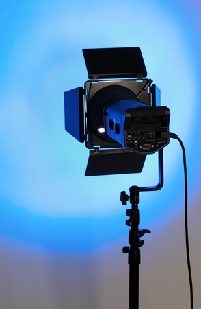 studio lighting on blue backgroundの写真素材