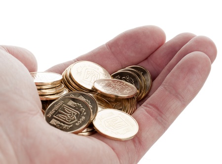 gold coins in his hand isolated on white backgroundの写真素材