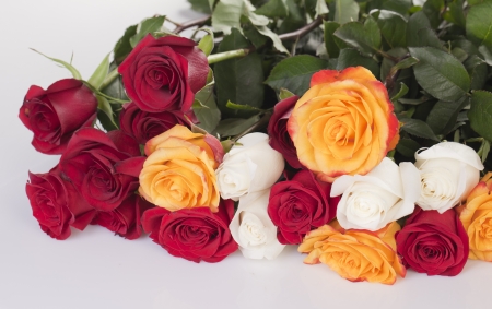 Bouquet of red, yellow and white roses closeup の写真素材