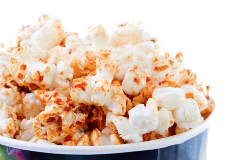 Popcorn in a bowl isolated on white backgroundの写真素材