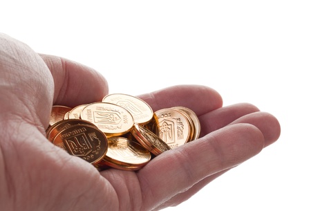 gold coins in his hand isolated on white backgroundの写真素材