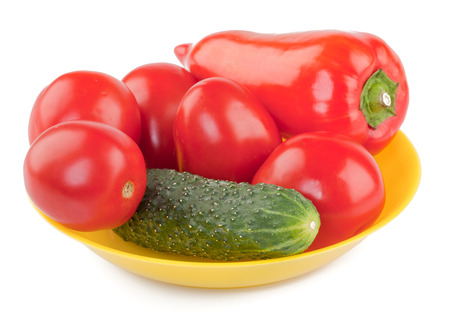 Tomatoes, Peppers and Cucumber in a bowl isolated on white の写真素材