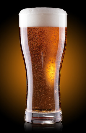 glass of beer with foamの写真素材