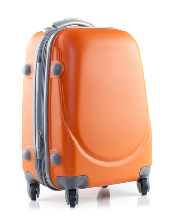Orange suitcase on a white background.の写真素材