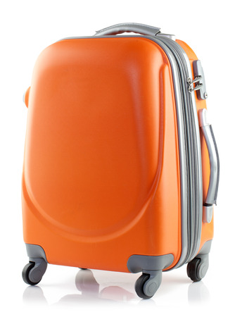 Orange suitcase on a white background.の写真素材