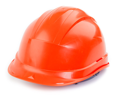 Orange plastic construction Helmet on a white backgroundの写真素材