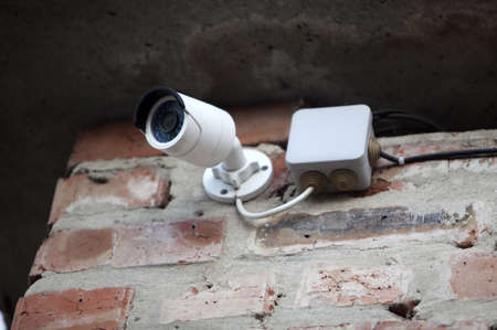 IP CCTV camera mounted on the wall, home security system concept.の写真素材