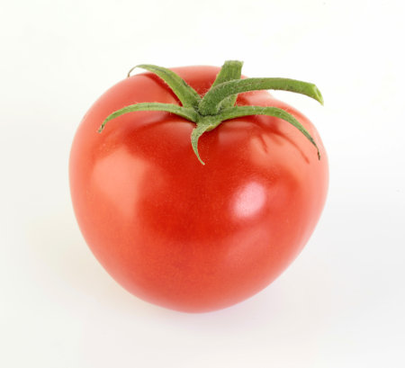 One Ripe red tomatoe on white background.の写真素材