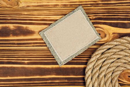 Wooden background with marine rope and copy spaceの写真素材
