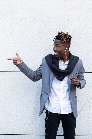 Ð£oung cool black man pointingの写真素材