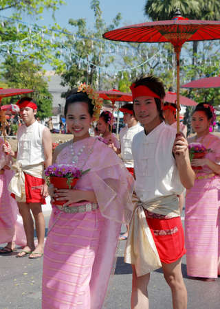 CHIANG MAI - FEB 6: Traditionally dressed young couple in procession on Chiang Mai 34th Flower Festival on February 6th, 2010. Chiang Mai, Thailand のeditorial素材