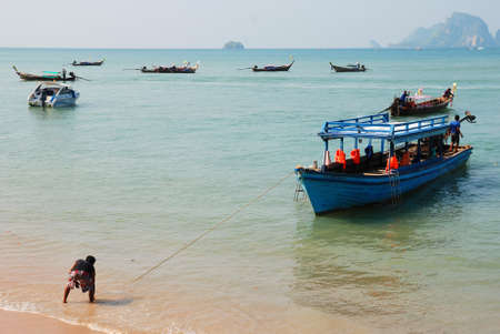 Ao Nang, Krabi, Thailand. April 14th, 2010.  Travel boat is ready to take tourists on board for one day snorkeling tourのeditorial素材
